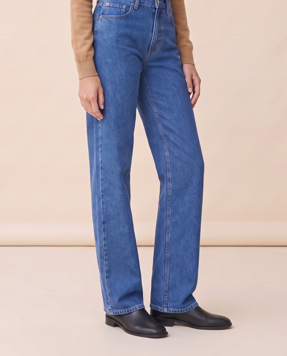 Straight-leg relaxed jeans, waist-down view