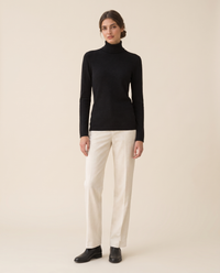 Merano Classic Solid Knit Turtleneck Sweater — studio front