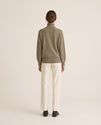 Erice Relaxed Loose-Fit Fine Knit Turtleneck Sweater — studio back