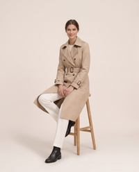 Mid-Length Double-Breasted Belted Trench Coat — worn seated