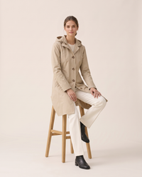 Lightweight Waterproof Trench Coat with Hood — worn seated
