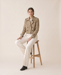 Vintage Cropped Trench Coat with Epaulettes — worn seated