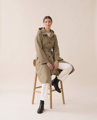 Waterproof Hooded Trench Coat for Women — worn seated