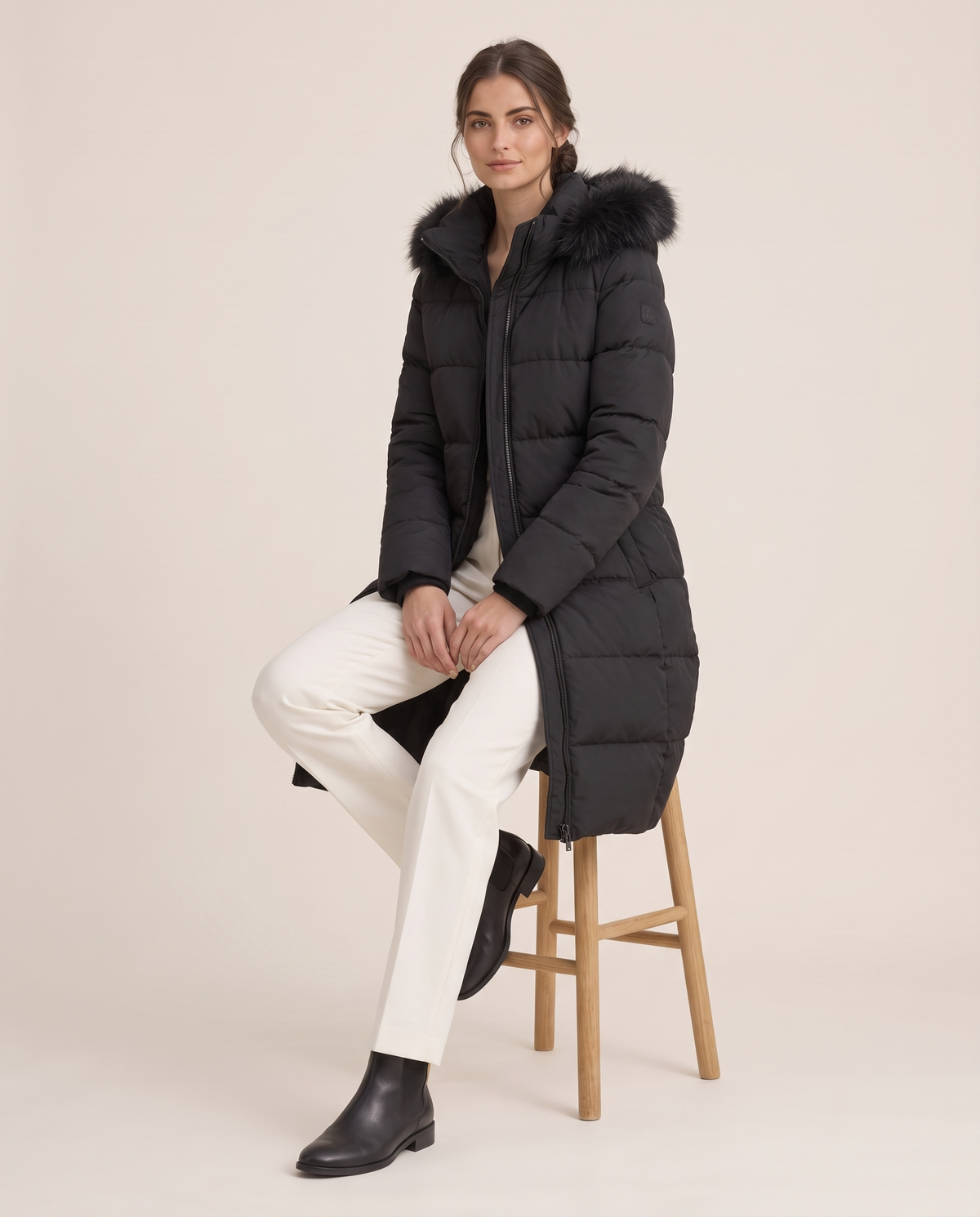 Long Hooded Puffer Coat with Plush Trim — worn seated