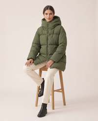Oversized Hooded Puffer Coat for Women — worn seated