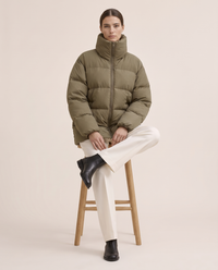 Oversized Quilted Puffer Jacket with Funnel Neck — worn seated