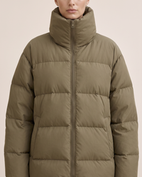 Oversized Quilted Puffer Jacket with Funnel Neck — funnel neck and quilting, worn