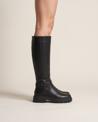 Knee-High Boots with Buckle Strap and Lug Sole — worn, side profile