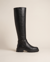Knee-High Boots with Buckle Strap and Lug Sole — single boot, side view