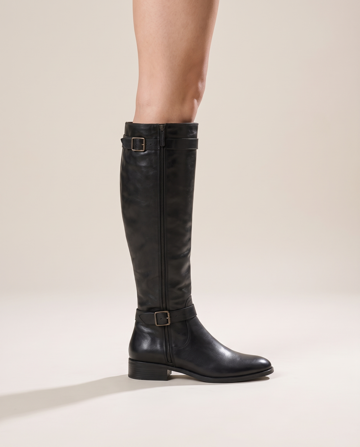 Knee-High Riding Boots with Buckle Straps and Low Block Heel — worn, side profile