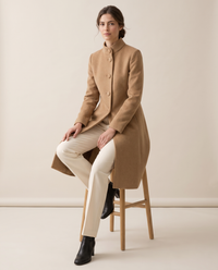 A-Line Coat with Stand Collar — worn seated