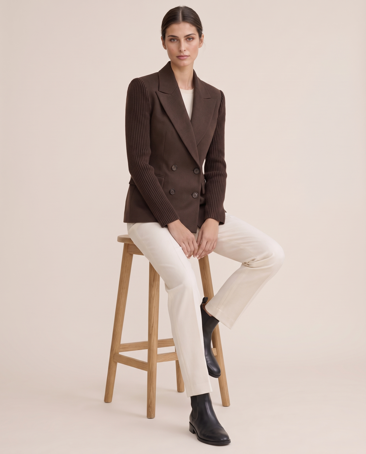 Cascadia Structured Double-Breasted Blazer with Ribbed Sleeves — worn seated