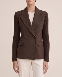 Cascadia Structured Double-Breasted Blazer with Ribbed Sleeves — lapels and ribbed cuffs, worn