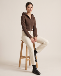 Double-Layer Hooded Zip Jacket — worn seated