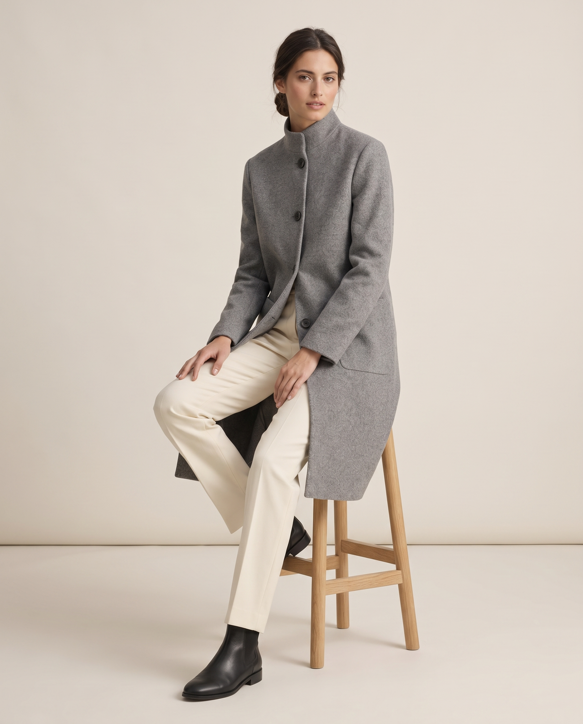 Stand-Collar Wool-Blend Coat with Pockets — worn seated
