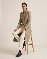 Slim-Fit Longline Coat for Women — worn seated