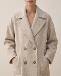 Oversized Double-Breasted Wool-Blend Coat — lapels and buttons, worn