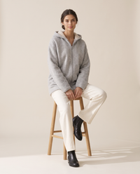 Oversized Hooded Fleece Jacket — worn seated