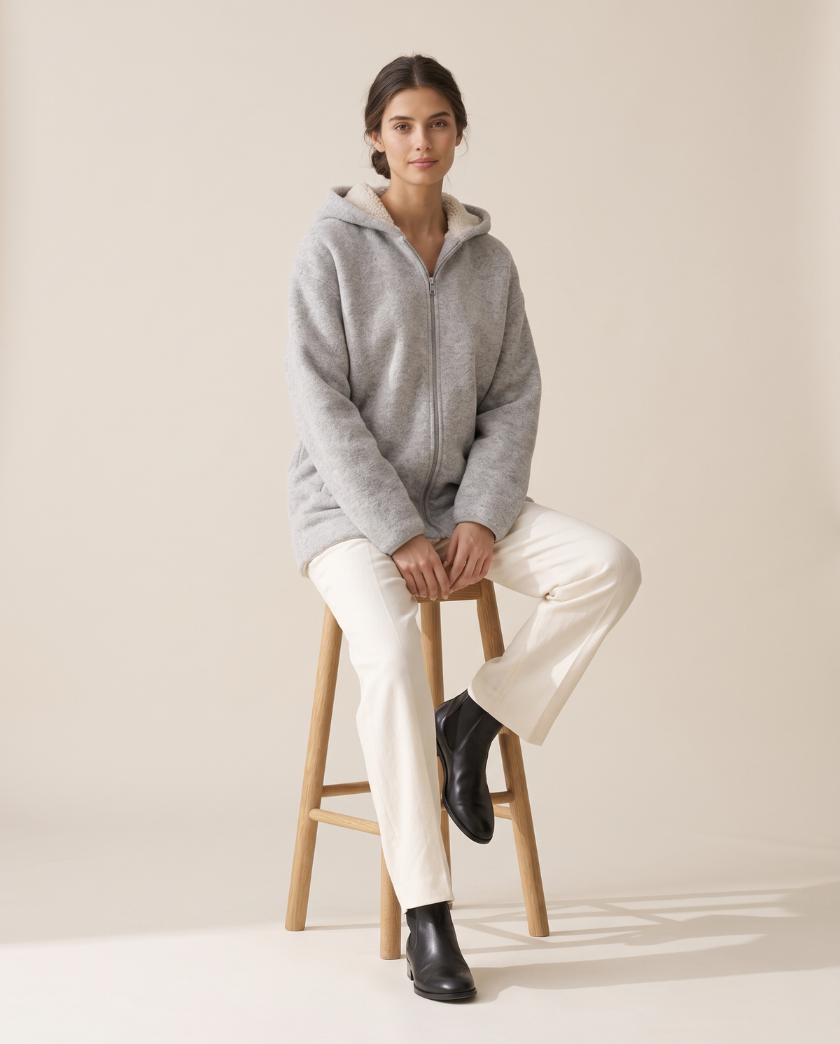 Oversized Hooded Fleece Jacket — worn seated