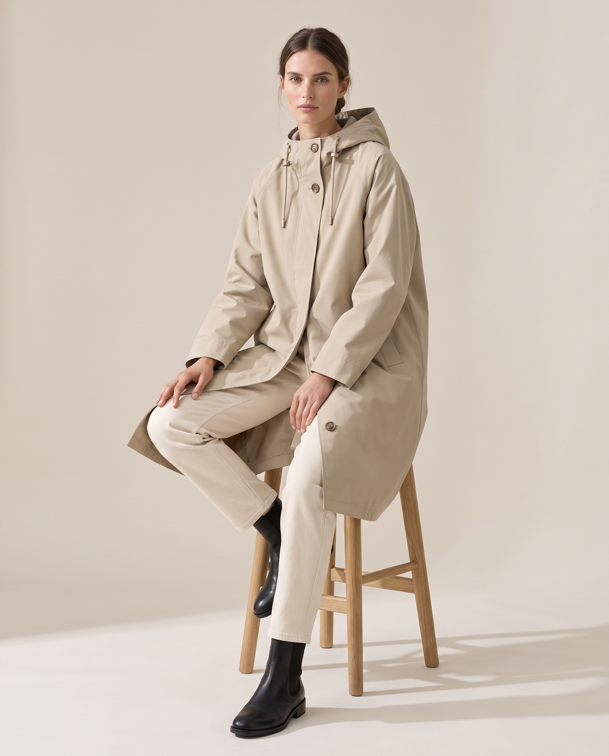 Oversized Hooded Raincoat for Women — worn seated