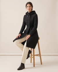 Fitted Hooded Coat with Textured Finish — worn seated