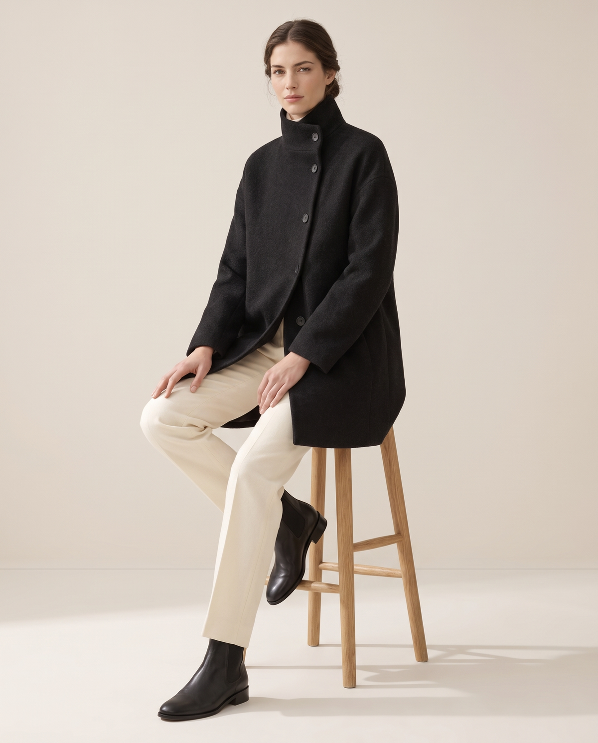 Wool-Blend Coat with Tall Stand Collar — worn seated