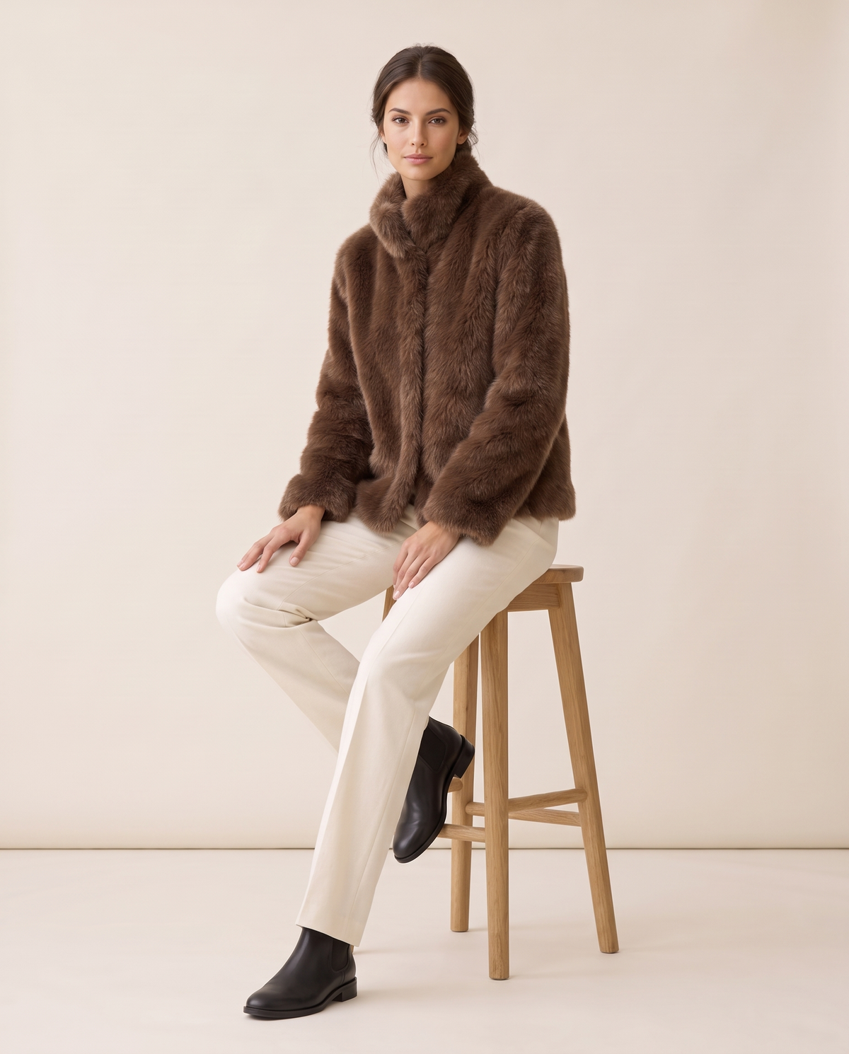 Short Faux Fur Coat with Stand Collar — worn seated