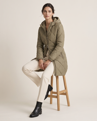 Waterproof Hooded Longline Winter Jacket — worn seated