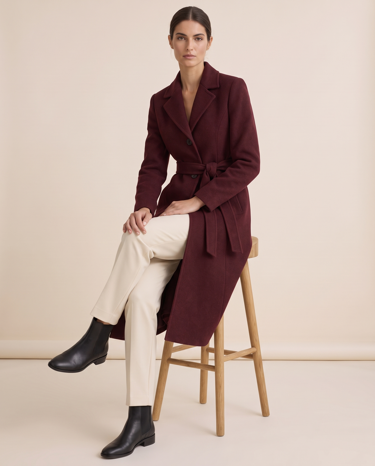 Burgundy Belted Long Coat for Women — worn seated