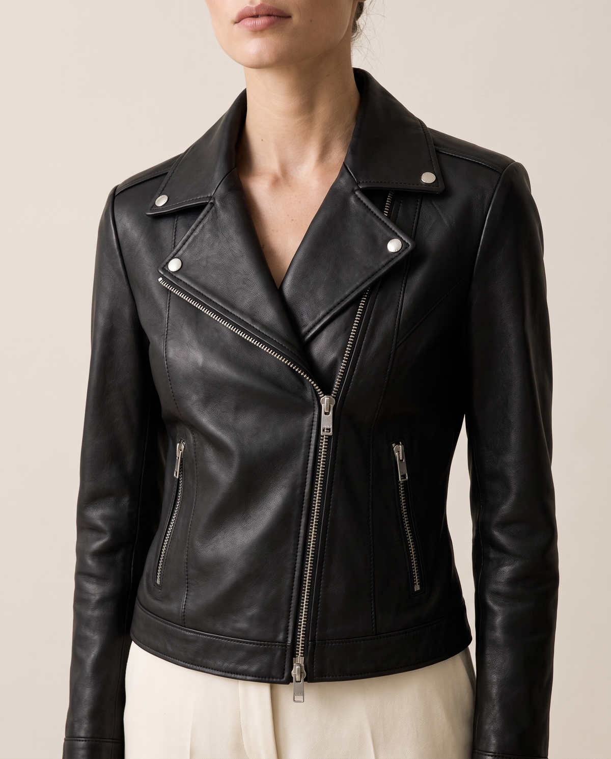 Notch-Lapel Leather Biker Jacket — lapels and hardware, worn