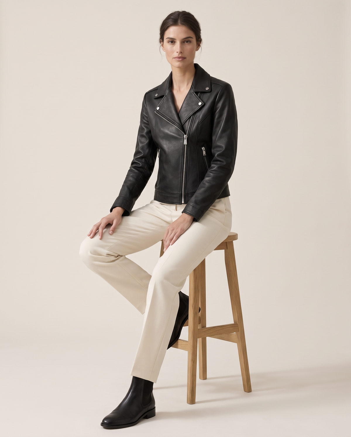 Notch-Lapel Leather Biker Jacket — worn seated