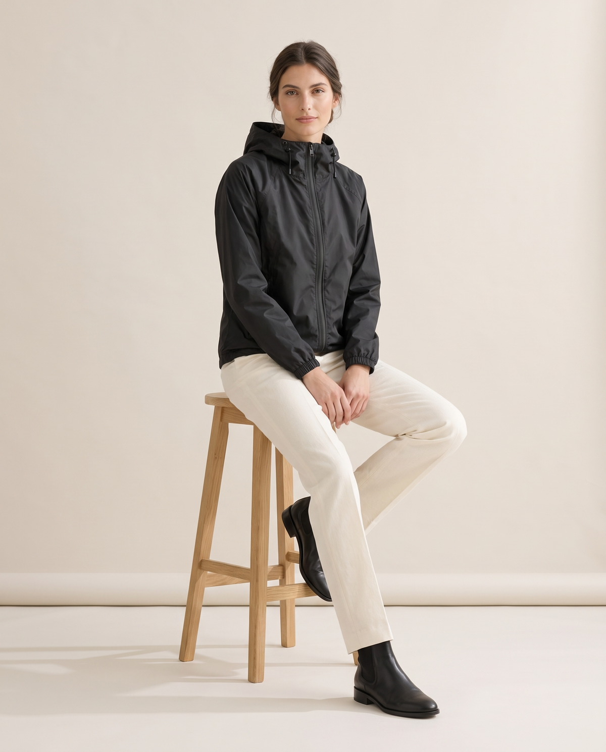Waterproof Hooded Windbreaker Jacket for Women — worn seated