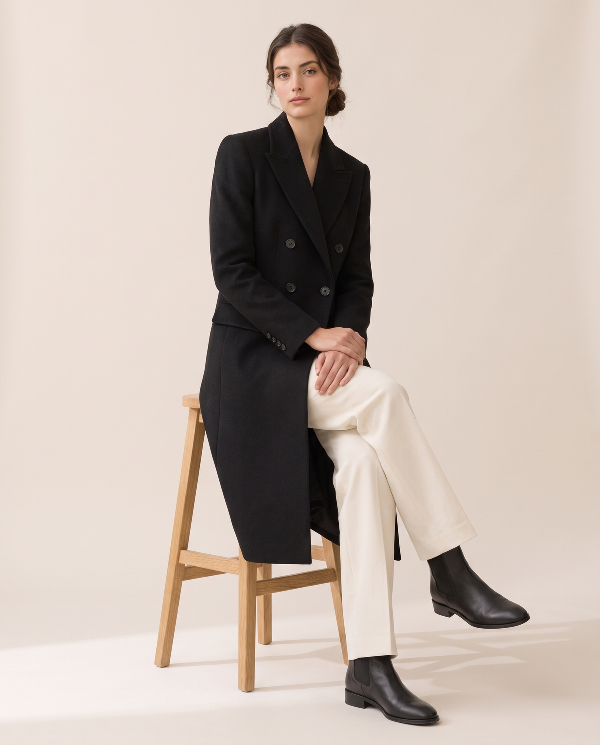 Longline Double-Breasted Tailored Coat — worn seated
