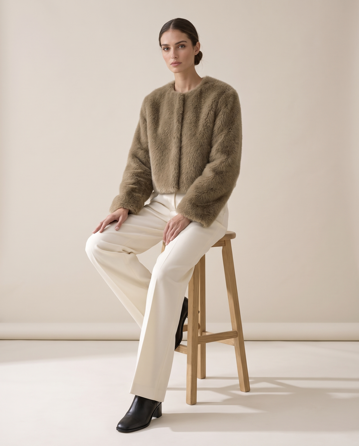 Cropped Faux Fur Jacket with Hidden Closure — worn seated