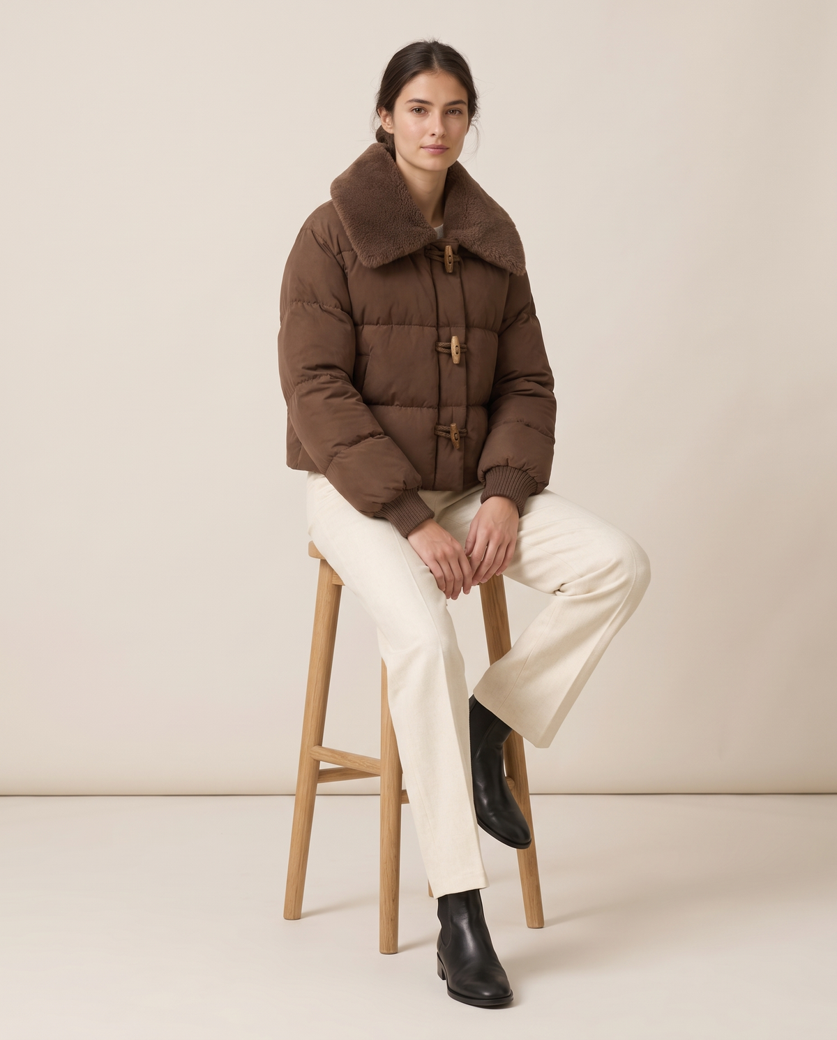 Cropped Puffer Jacket with Plush Collar — worn seated