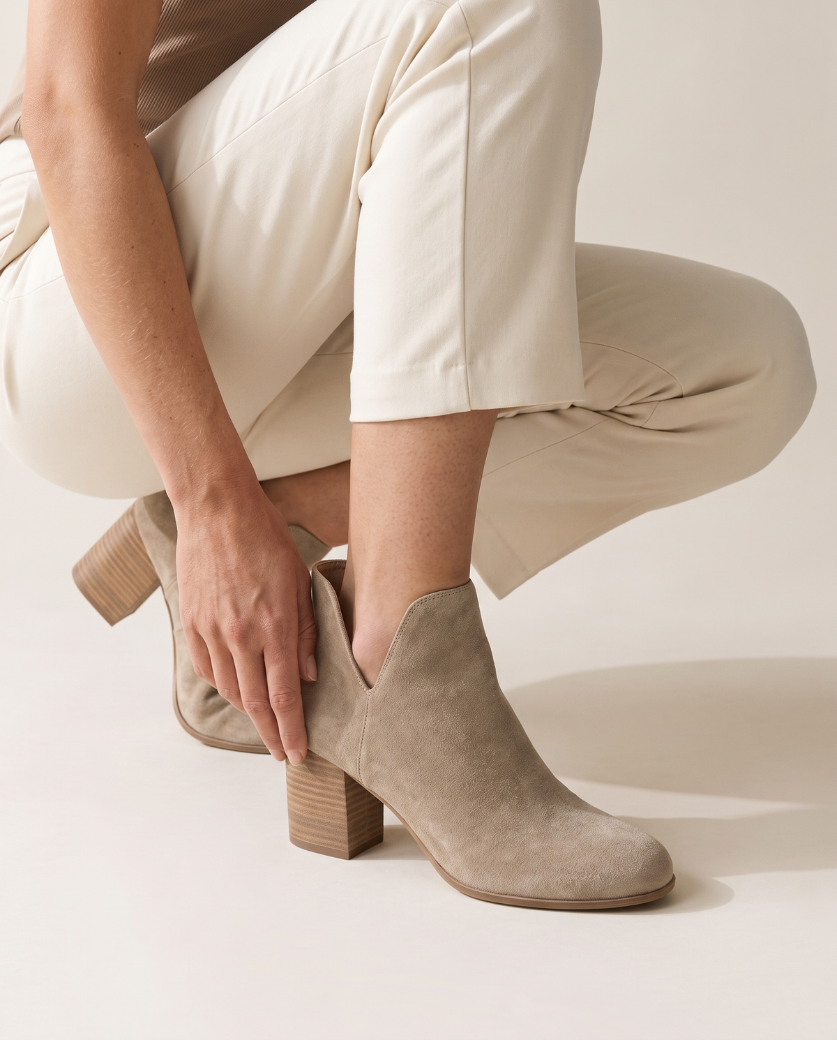 Suede Ankle Boots with V-Cut and Block Heel — worn, crouching
