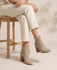 Suede Ankle Boots with V-Cut and Block Heel — worn seated