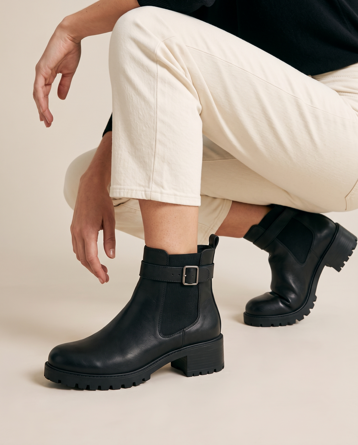 Pull-On Ankle Boots with Buckle Strap and Lug Sole — worn, crouching