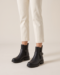 Pull-On Ankle Boots with Buckle Strap and Lug Sole — worn, studio