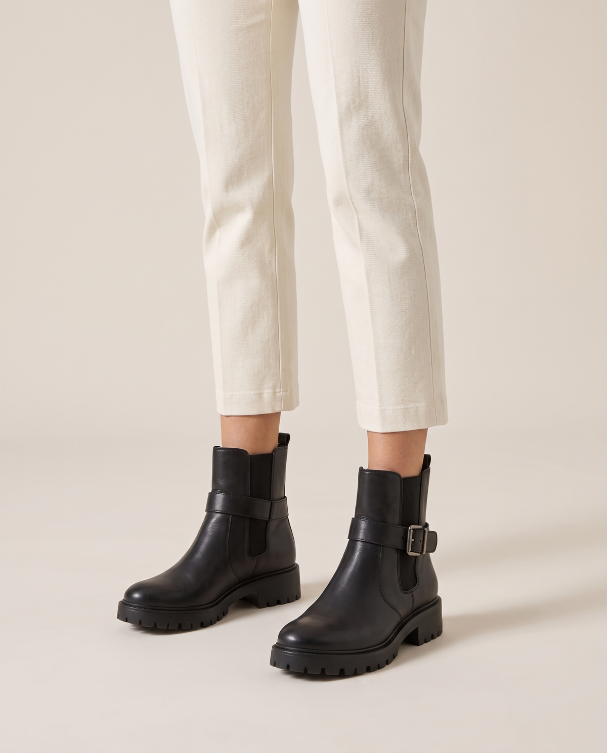 Pull-On Ankle Boots with Buckle Strap and Lug Sole — worn, studio