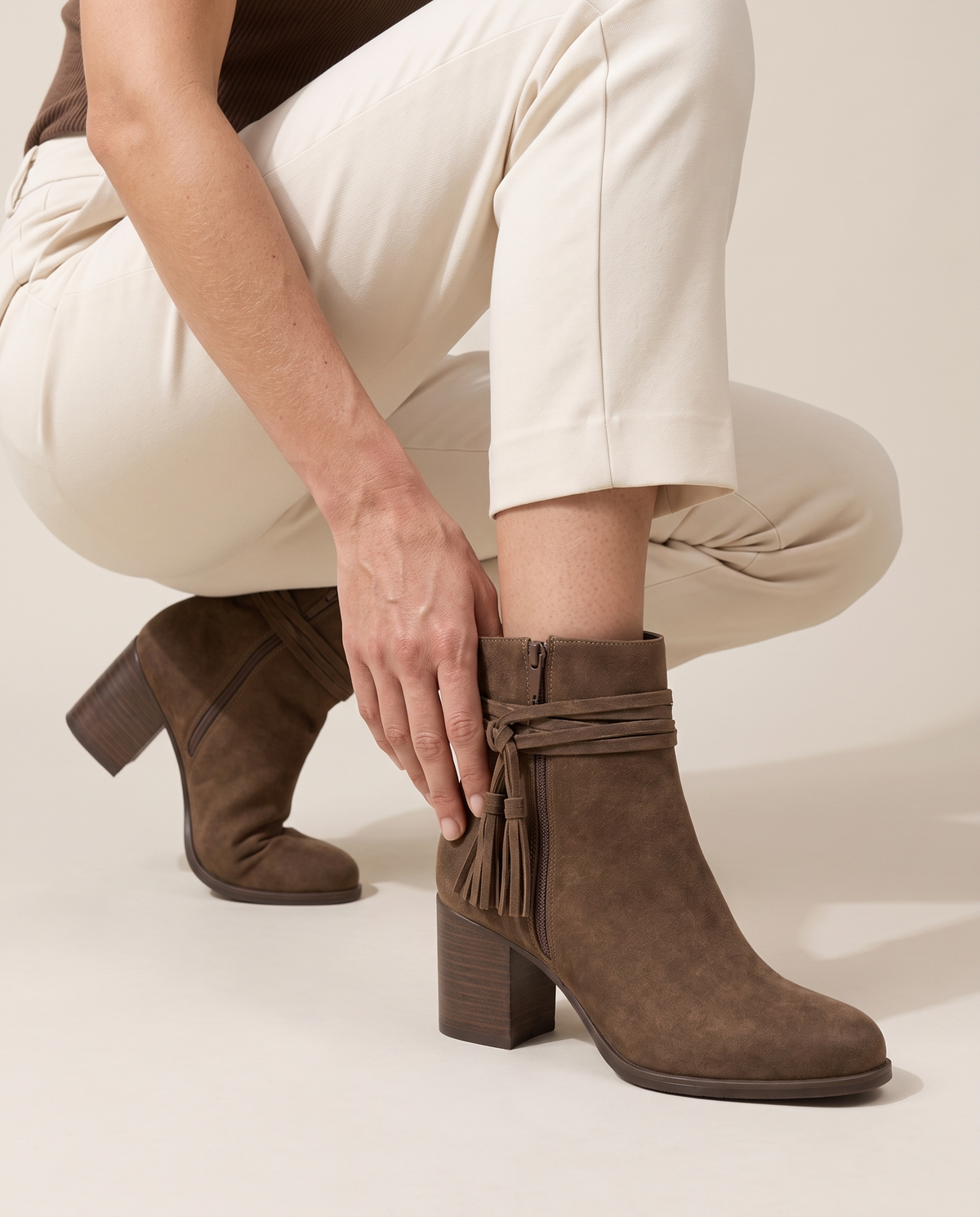 Block Heel Ankle Boots with Tassel Wrap Straps — worn, crouching