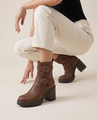 Moto Ankle Boots with Double Buckle and Chunky Heel — worn, crouching