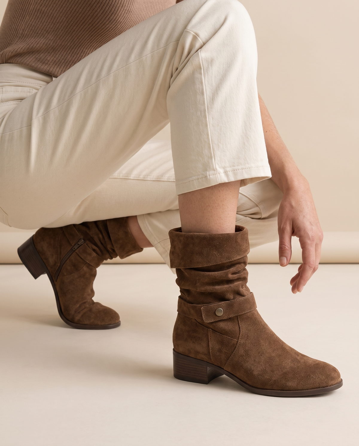 Suede Slouch Ankle Boots with Fold-Over Cuff — worn, crouching