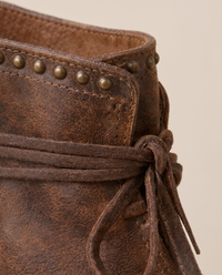 Lace-Up Western Ankle Boots with Studded Trim — studs and lacing close-up