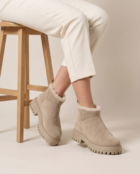 Fleece-Lined Suede Ankle Boots with Chunky Lug Sole — worn seated