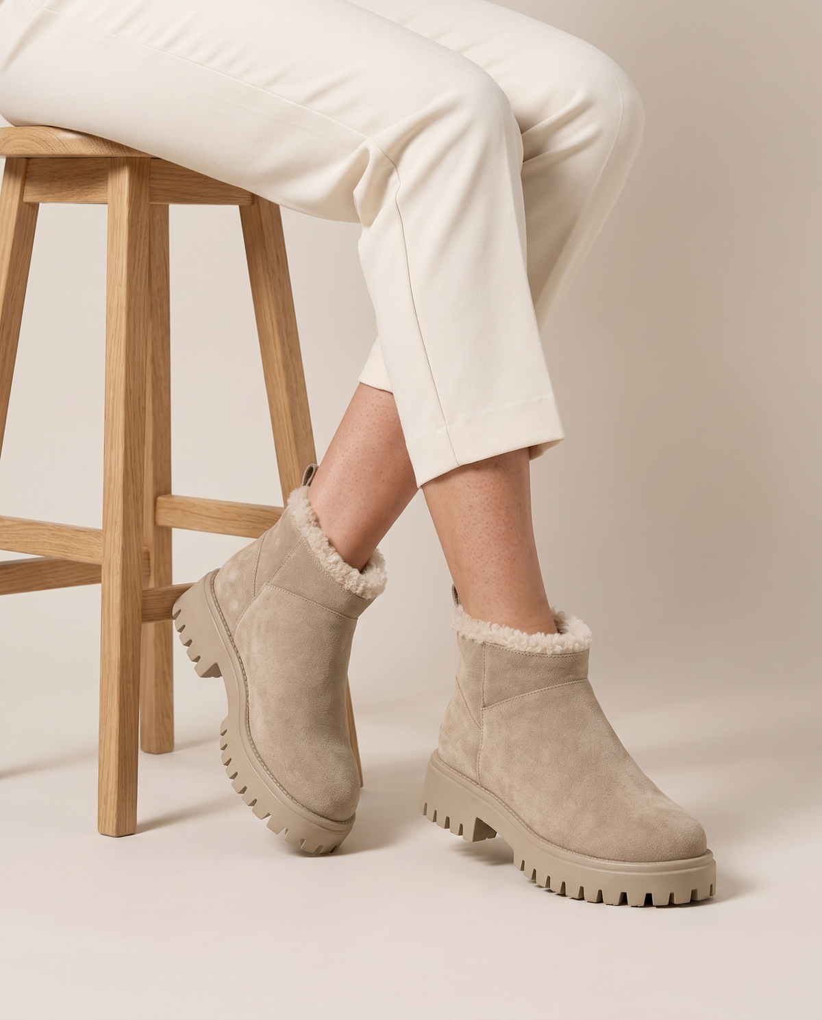 Fleece-Lined Suede Ankle Boots with Chunky Lug Sole — worn seated