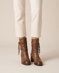 Lace-Up Western Ankle Boots with Studded Trim — worn, studio