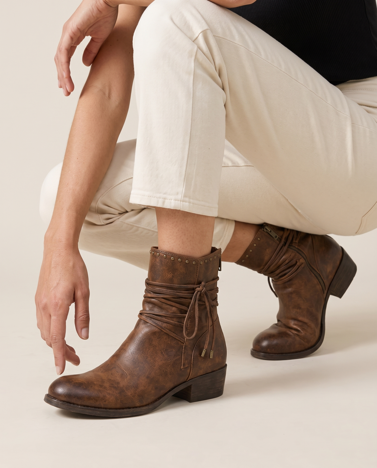 Lace-Up Western Ankle Boots with Studded Trim — worn, crouching