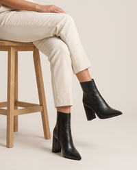 Leather Ankle Boots with Pointed Toe and Block Heel — worn seated