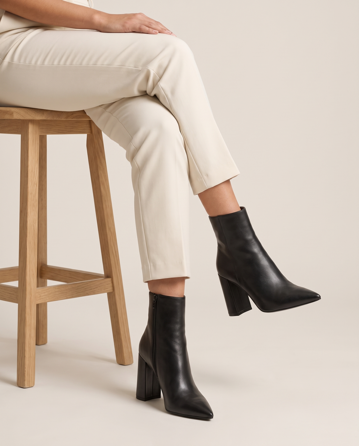 Leather Ankle Boots with Pointed Toe and Block Heel — worn seated